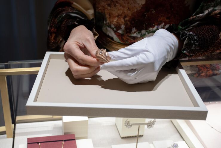 An employee holds a Plume de Paon ring inside the renovated Boucheron luxury jewelry flagship store, operated by Kering SA, ahead of reopening in Place Vendome Square in Paris, France, on Monday, Dec. 3, 2018. Boucheron is part of the elite club of French jewelers that produce haute joaillerie, or high jewelry: one-of-a-kind pieces priced from $50,000 to several million dollars, which are handcrafted in Vendome ateliers to show off precious stones and their makers’ most advanced techniques. Photographer: Christophe Morin/Bloomberg