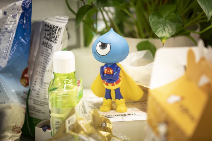 A toy figurine of the Ant Group mascot sits on a desk at the company's headquarters in Hangzhou, China, on Sept. 28, 2020.