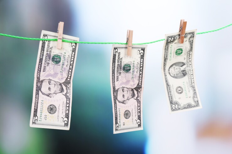 Dollar bills hanging