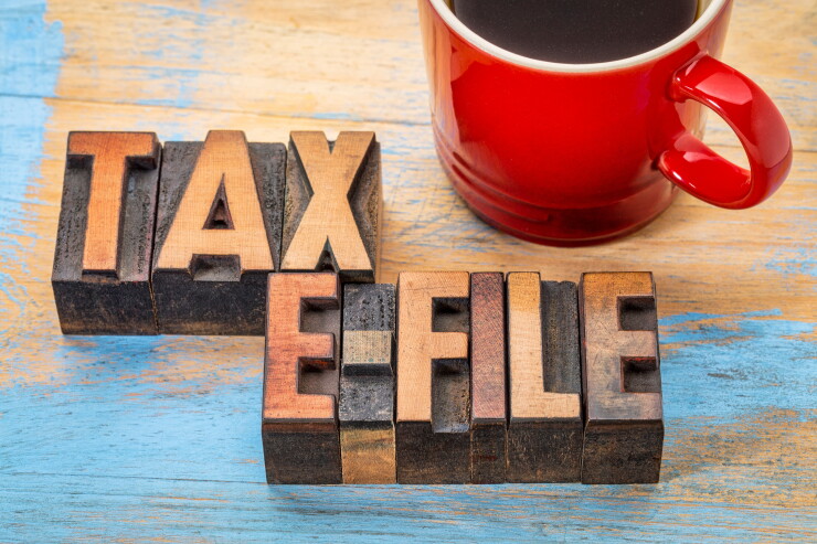 tax electronic filing concept - word abstract in vintage letterpress wood type with a cup of coffee