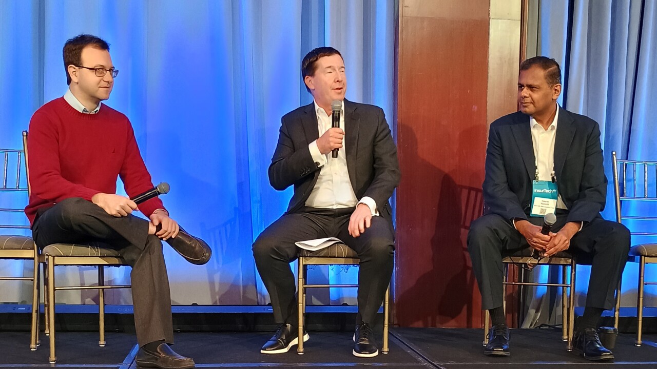 David Gritz, Greg Hendrick and Gaurav Vasisht, seated in panel discussion.