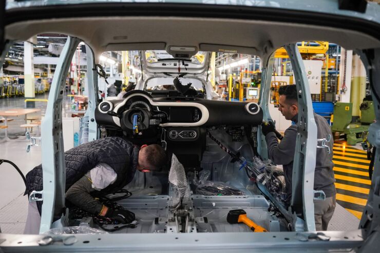 Employees fit the dashboard of a Renault Twingo automobile on the production line at the Renault Revoz d.d. plant, a unit of Renault SA, in Novo Mesto, Slovenia, on Wednesday, Nov. 16, 2022. Renault last week presented a radical overhaul plan to investors, proceeding with a complex split of Renault's electric-vehicle and combustion-engine businesses. Photographer: Oliver Bunic/Bloomberg