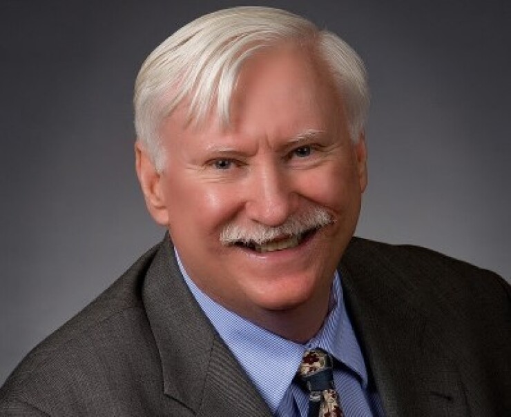 Ashton Ryan, former CEO of First NBC, has been charged with fraud tied to the bank's 2017 failure.