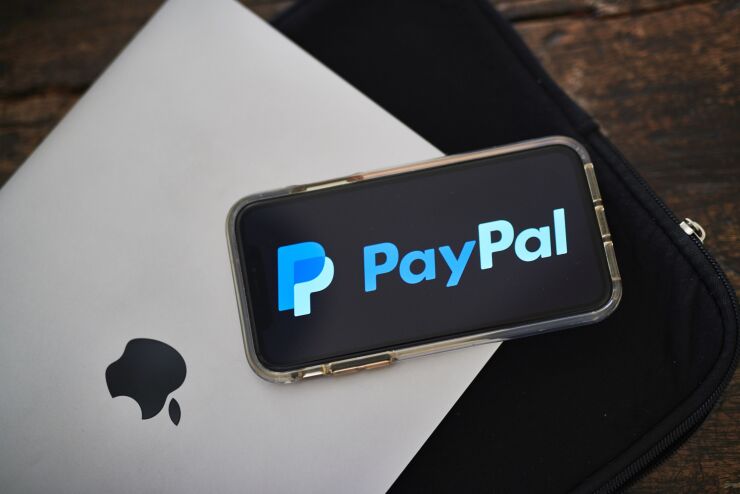 PayPal Holdings Inc. signage is displayed on an Apple Inc. iPhone in an arranged photograph taken in Little Falls, New Jersey, U.S., on Saturday, July 20, 2019. Paypal Holdings Inc. is scheduled to release earnings figures on July 24. Photographer: Gabby Jones/Bloomberg