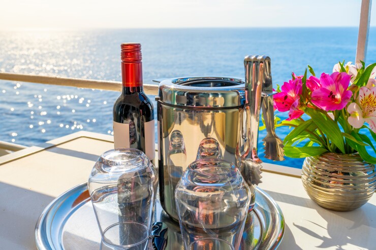 Wine bottle of wine, flowers on a cruise ship.