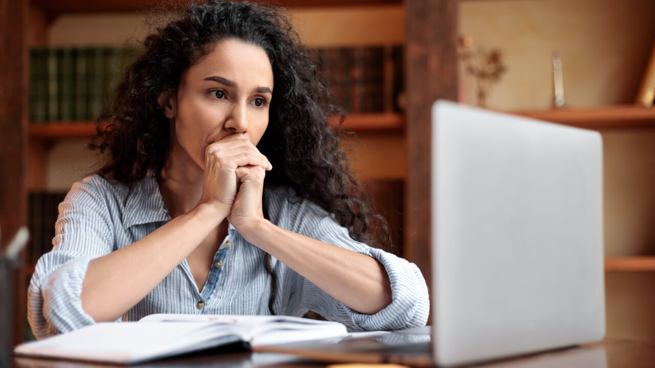Woman concerned at her computer