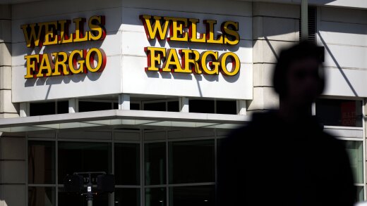 Signage is displayed outside a Wells Fargo bank branch in Los Angeles.