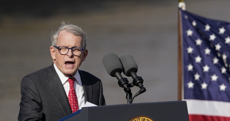 Ohio Gov. Mike DeWine speaks at lectern