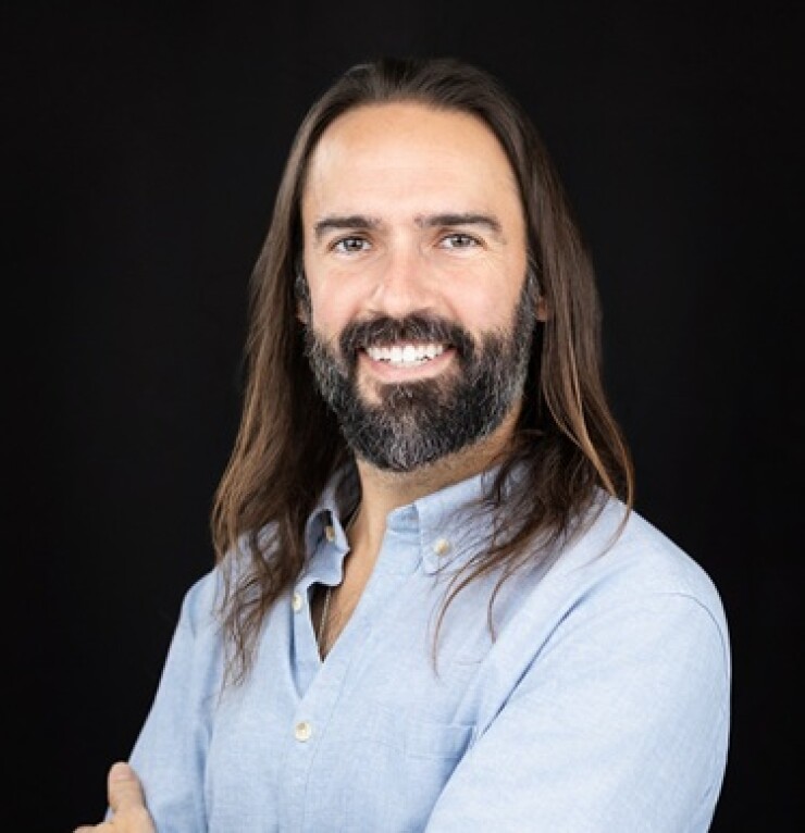 Headshot of Daniel Herrington.