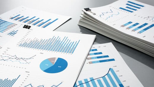 Preparing report. Blue graphs and charts.