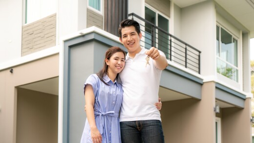 Portrait of Asian young couple standing and hugging together and