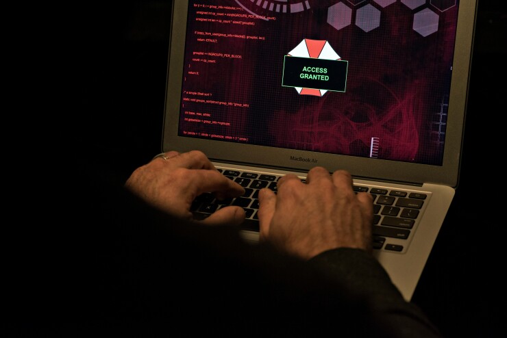 Simulation of someone using a computer to hack.