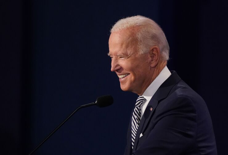 Joe Biden, 2020 Democratic presidential nominee, smiles during the first U.S. presidential debate hosted by Case Western Reserve University and the Cleveland Clinic in Cleveland, Ohio, U.S., on Tuesday, Sept. 29, 2020. Trump and Biden kick off their first debate with contentious topics like the Supreme Court and the coronavirus pandemic suddenly joined by yet another potentially explosive question -- whether the president ducked paying his taxes. Photographer: Kevin Dietsch/UPI/Bloomberg