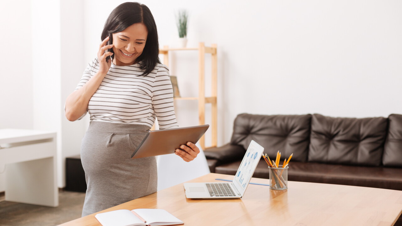 Pregnant woman in office