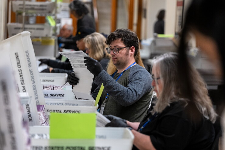 California election workers sort mail-in ballots during the June 2 primary.