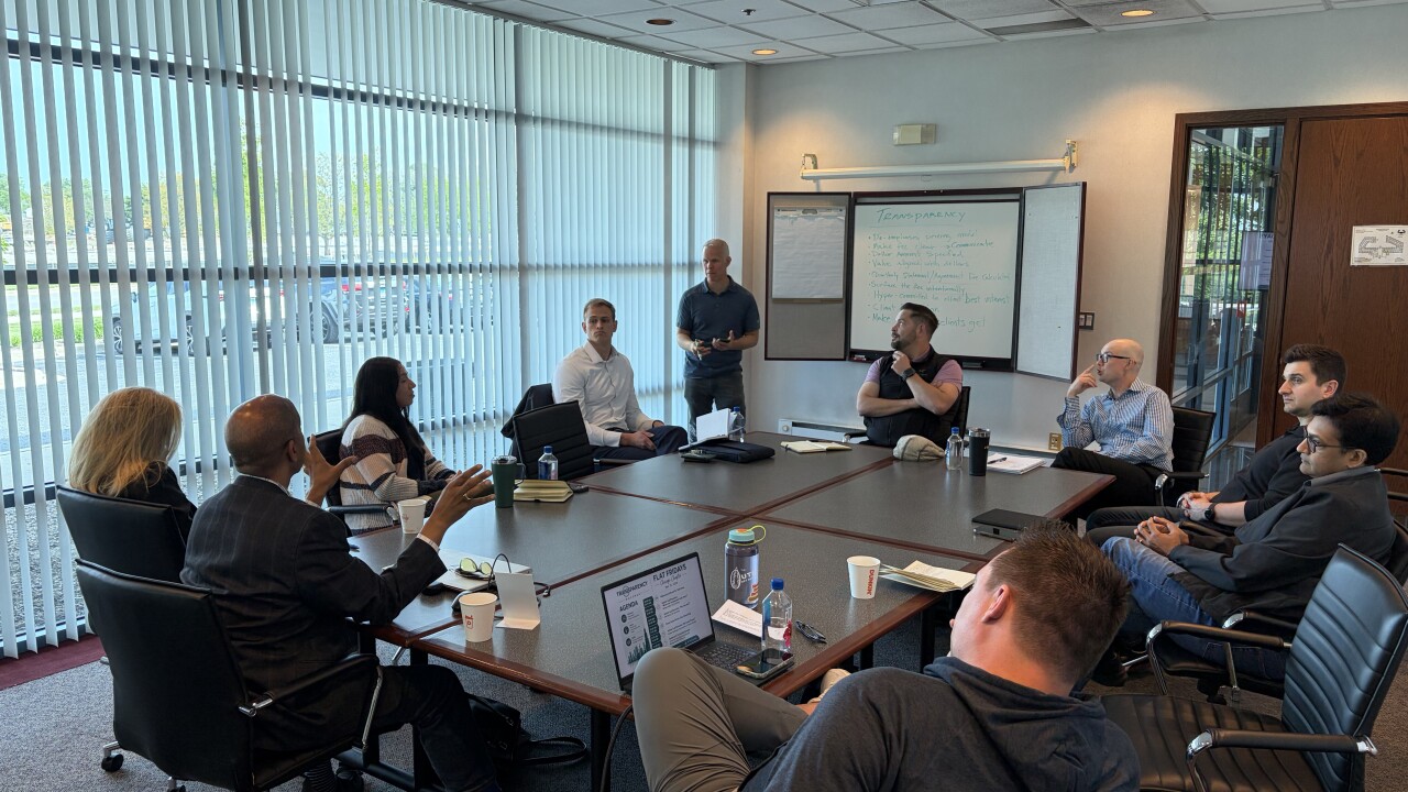 Financial planner Michael Hollis led a discussion among a dozen advisors and other professionals in the field about the meaning of transparency at a Transparent Advisor Movement "Flat Fridays" meeting last week outside Chicago.