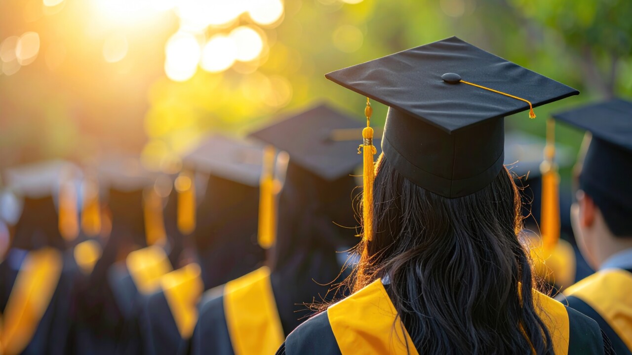 A group of graduates in caps and gowns walk into a bright, sunlit future, symbolizing achievement and new beginnings in academia.