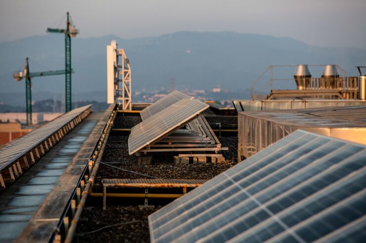 Photovoltaic panels installed by Sud Energies Renovables SL on the roof of a building at the Banco de Sabadell SA headquarters in Sant Cugat del Valles, Spain, on Wednesday, March 10, 2021. Spain’s first power auction in four years awarded 3 gigawatts of new wind and solar capacity in the latest push to clean up its energy systems. Photographer: Angel Garcia/Bloomberg