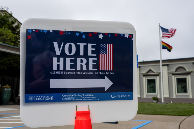 Vote here sign