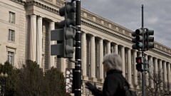 A pedestrian walks past the IRS headquarters in Washington, D.C.