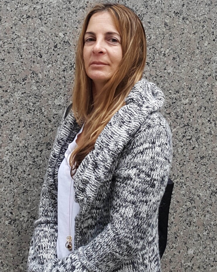 Jennifer Sharkey said the bank ruined her career by illegally dismissing her.