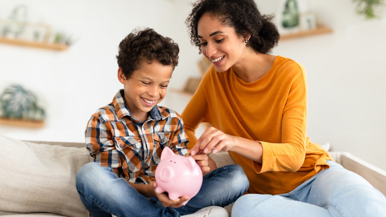Couple saving money in piggybank