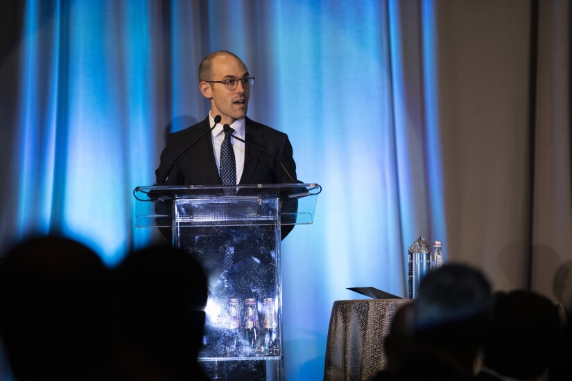 Michael Gaughan accepts the Small Issuer award.