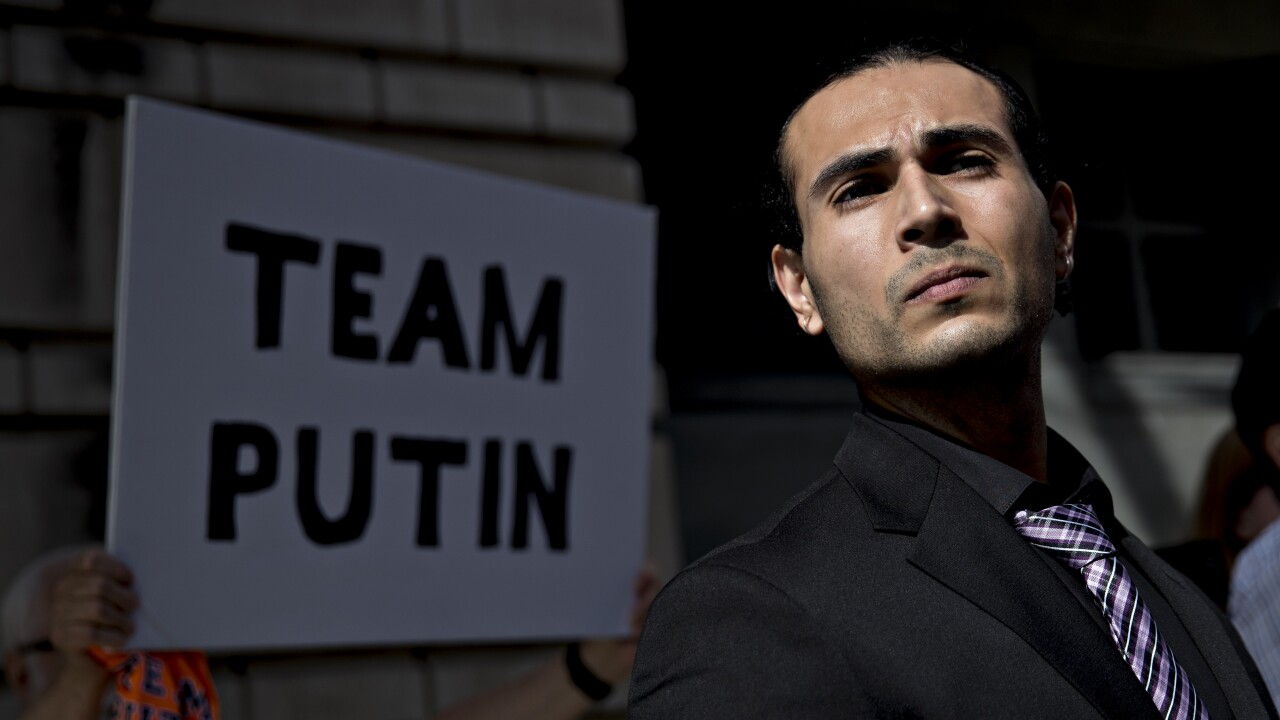 Richard Pinedo of Santa Paula, California, listens as his lawyer speaks to members of the media outside federal court after sentencing in Washington, D.C.