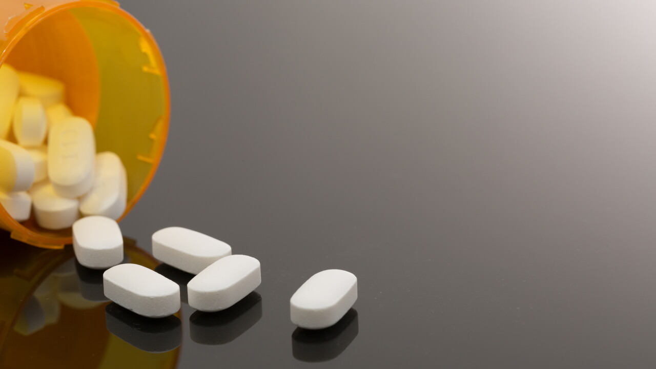 Pills spilling out of a prescription drug bottle