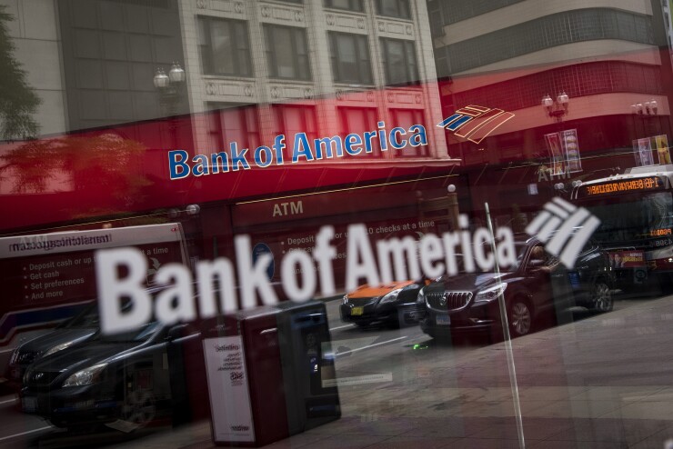 Vehicles reflected in window of a Bank of America branch in Chicago, July 9, 2017 Bloomberg News
