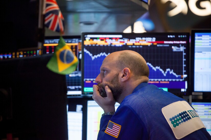 The downward stock market move was sparked by U.S. wage data on Friday.