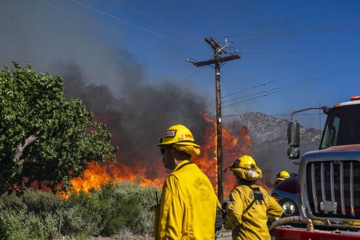 Firefighters battle the Post Fire in Gorman, California