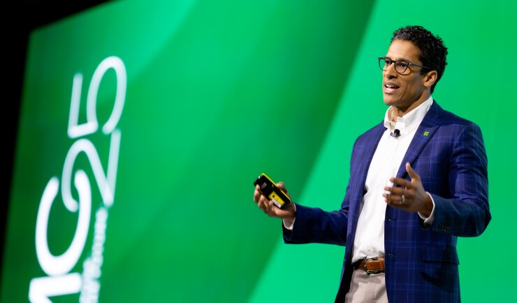 Ted Paris speaking on stage