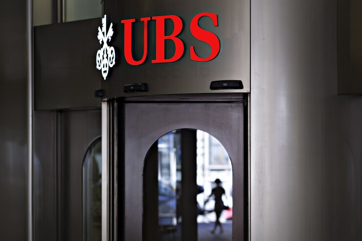 Illuminated sign at UBS Group headquarters in Zurich, Switzerland, on July 6, 2017 Bloomberg News