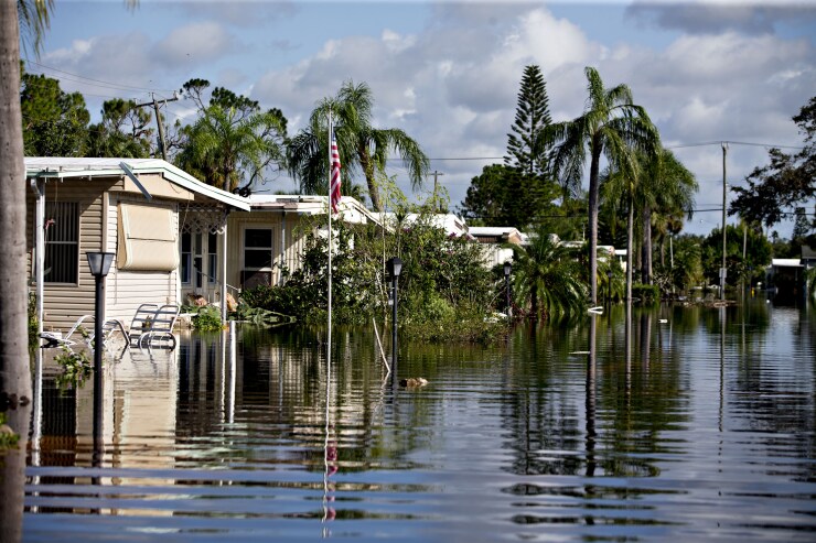 Mobile homes stand in a flooded neighborhood in Bonita Springs, Florida, after Hurricane Irma.