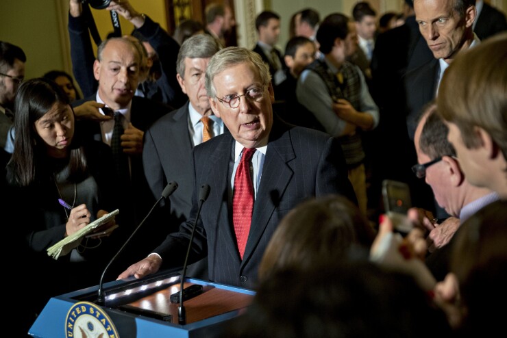 Senate Majority Leader Mitch McConnell, a Republican from Kentucky, center, speaks during a news conference after a weekly GOP luncheon meeting at the U.S. Capitol in Washington, D.C.