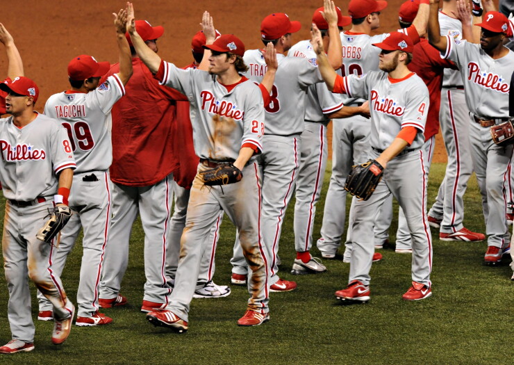 Philadelphia Phillies players congratulate one another after defeating the Tampa Bay Rays in game one of the World Series in 2008.