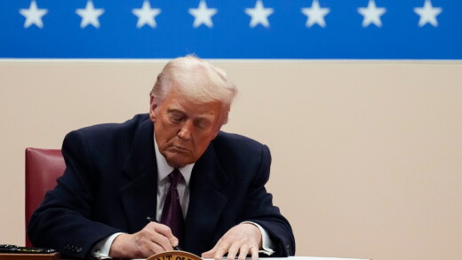 President Donald Trump signs an executive order