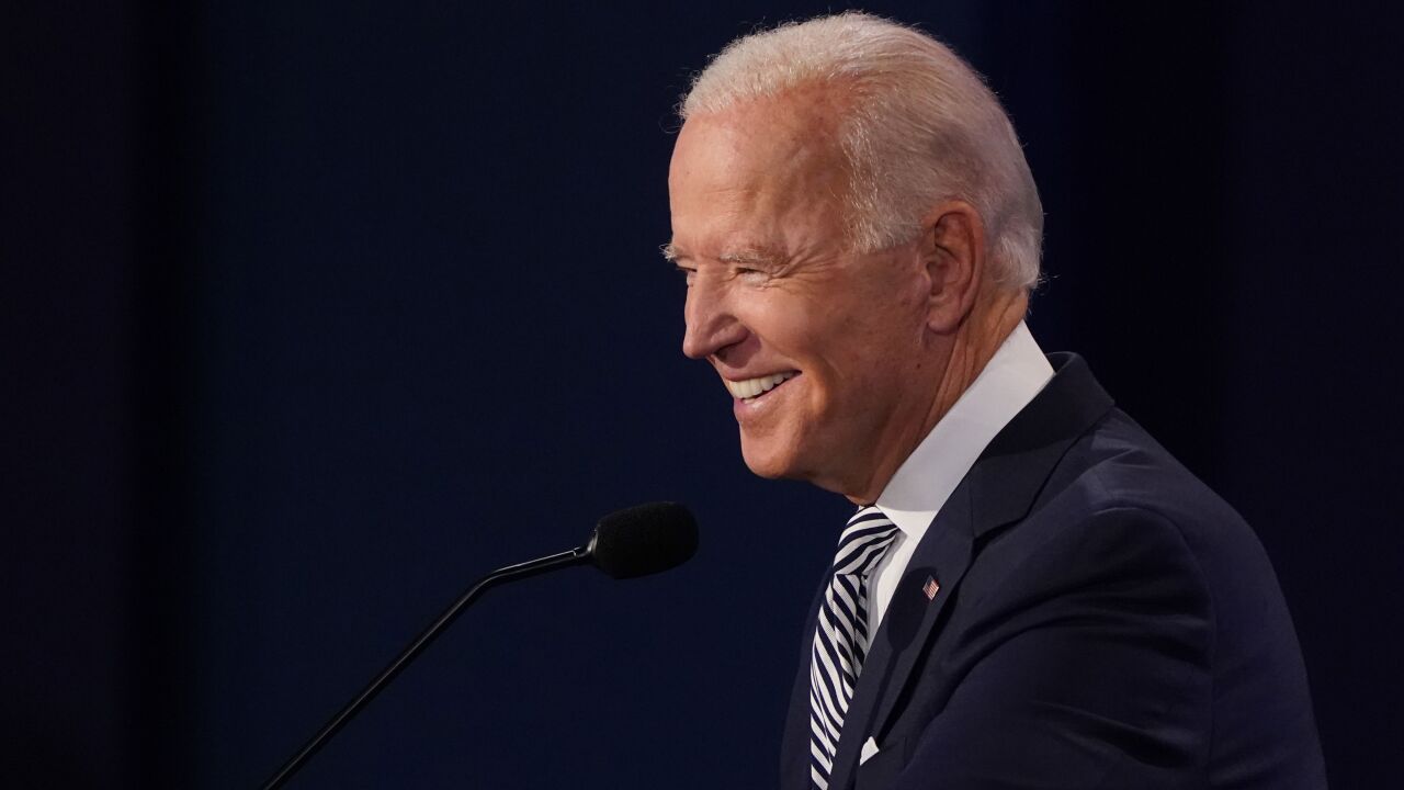 Joe Biden, 2020 Democratic presidential nominee, smiles during the first U.S. presidential debate hosted by Case Western Reserve University and the Cleveland Clinic in Cleveland, Ohio, U.S., on Tuesday, Sept. 29, 2020. Trump and Biden kick off their first debate with contentious topics like the Supreme Court and the coronavirus pandemic suddenly joined by yet another potentially explosive question -- whether the president ducked paying his taxes. Photographer: Kevin Dietsch/UPI/Bloomberg