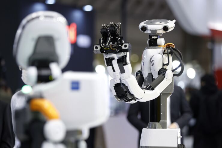 A Kawada Robotics Co. Nextage Fillie robot during a demonstration at the International Robot Exhibition in Tokyo, Japan, on Wednesday, March 9, 2022. The expo at Tokyo Big Sight runs through March 12. Photographer: Kiyoshi Ota/Bloomberg