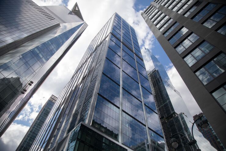 BlackRock headquarters in New York -- tall, glass skyscraper pictured from the ground.