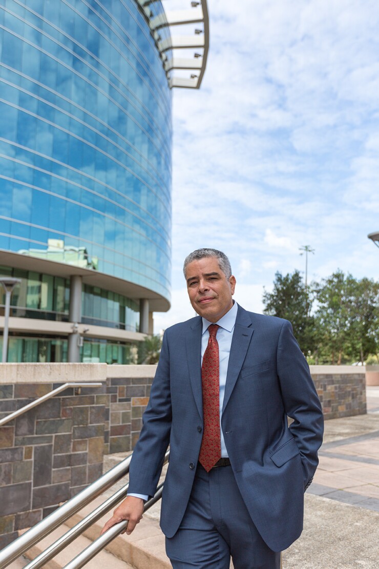 PREPA executive director Ricardo Ramos standing
