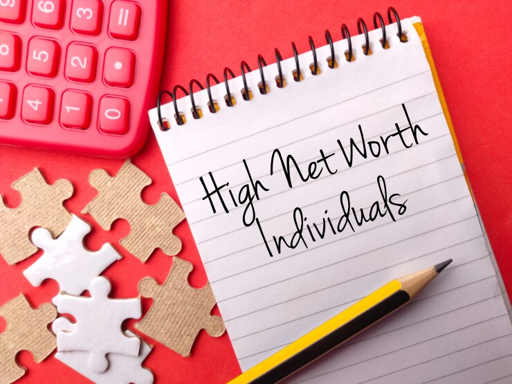 Calculator, puzzle, and pencil - notepad on High Net Worth Individuals