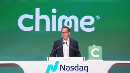 Chris Britt stands at a podium for Chime IPO at Nasdaq.jpg