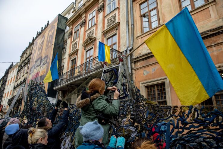 Volunteers tie pieces of fabric while making camouflage nets at the Ivanychuk Library in Lviv, Ukraine, on Tuesday, March 1, 2022. Russia's armed forces will continue their "military operation" in Ukraine until they meet their goals, Interfax quoted Defense Minister Sergei Shoigu as saying. Photographer: Ethan Swope/Bloomberg