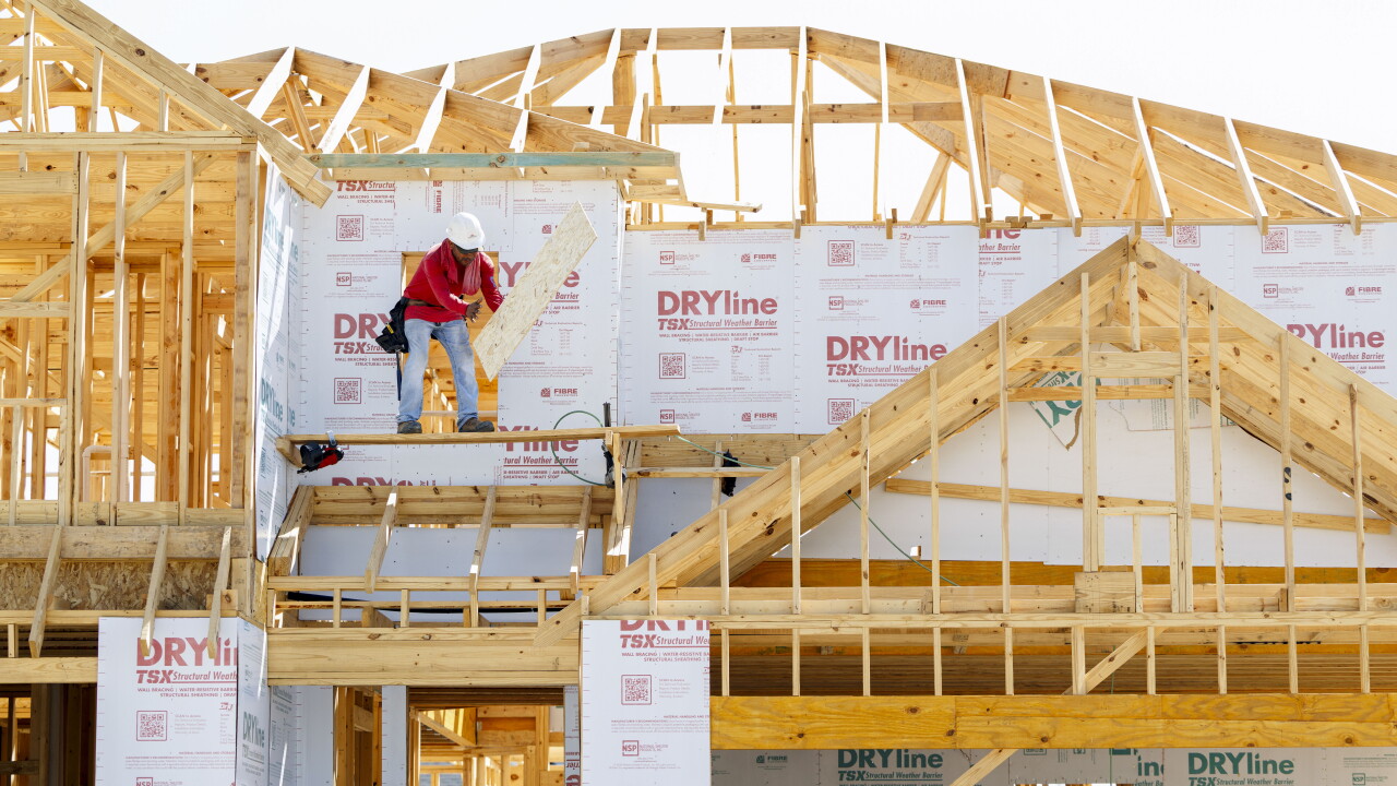 A worker on a new home under construction