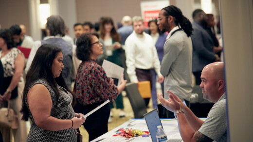 A picture of job hunters at a jobs fair.