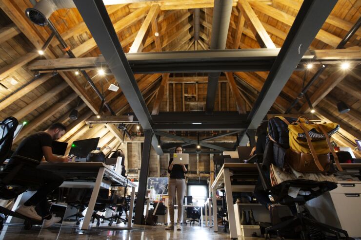 Employees work in the Lightspeed POS Inc. head office in Montreal, Quebec, Canada, on Monday, Sept. 9, 2019. Lightspeed, which had its initial public offering in March, provides a cloud-based sales platform for stores and restaurants. Photographer: Christinne Muschi/Bloomberg