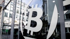 A logo sits on the windows of the offices of La Maison du Bitcoin bank in Paris, France.
