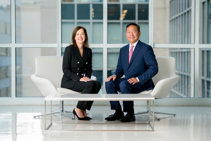 Meredith Hathorn, MSRB Chair and Mark Kim, MSRB CEO sit in chairs